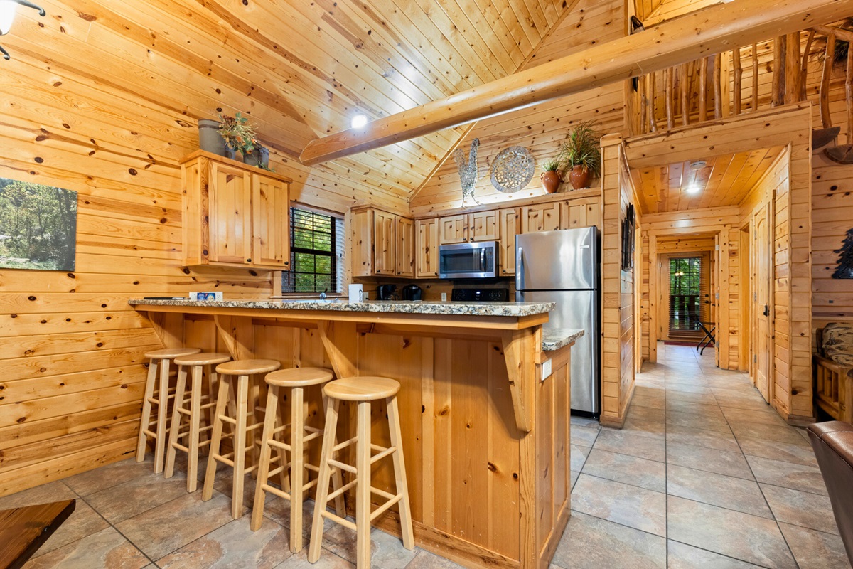 Bar seating and open kitchen space for group cooking fun.