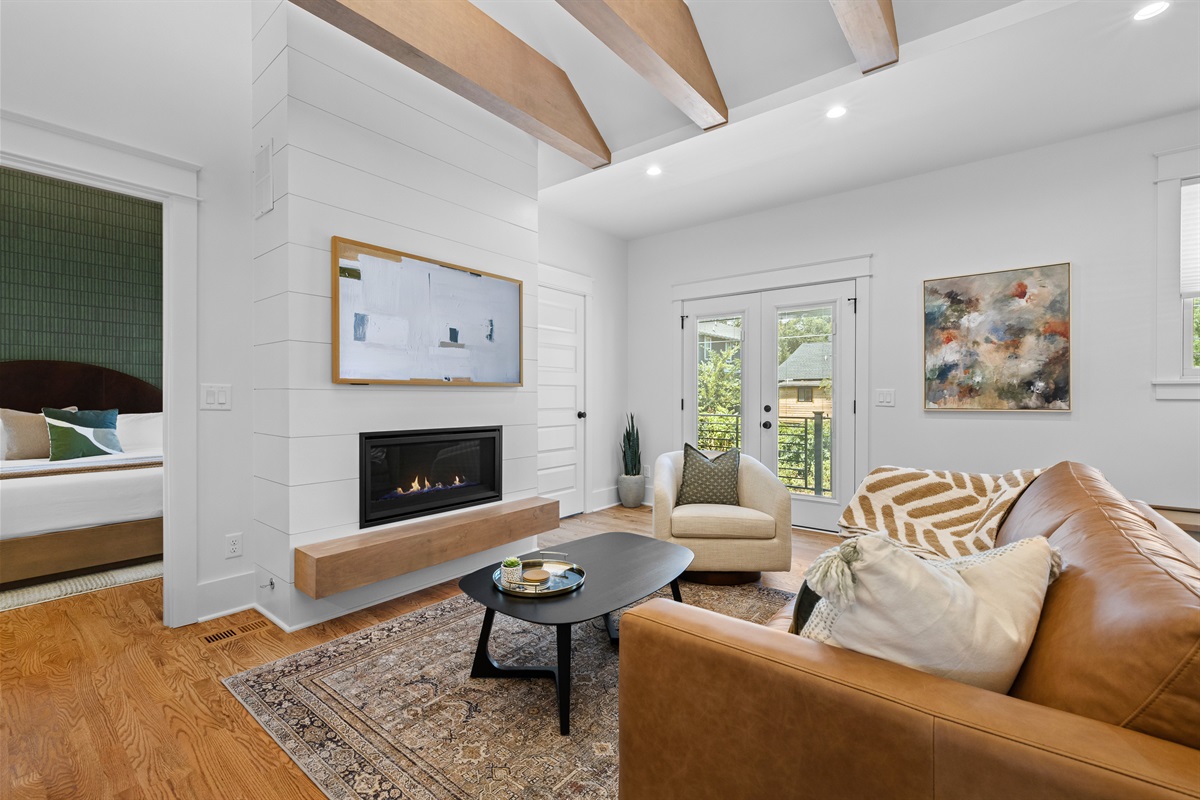 Cozy up by the gas fireplace with a movie on the Smart TV.