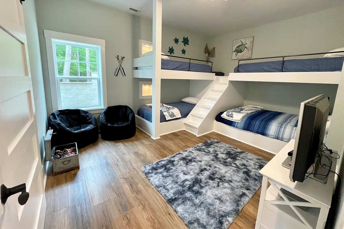 Basement bunk room (bdrm 4) has 1 Queen and 3 Twin XLs complete with Xbox360, toys and books