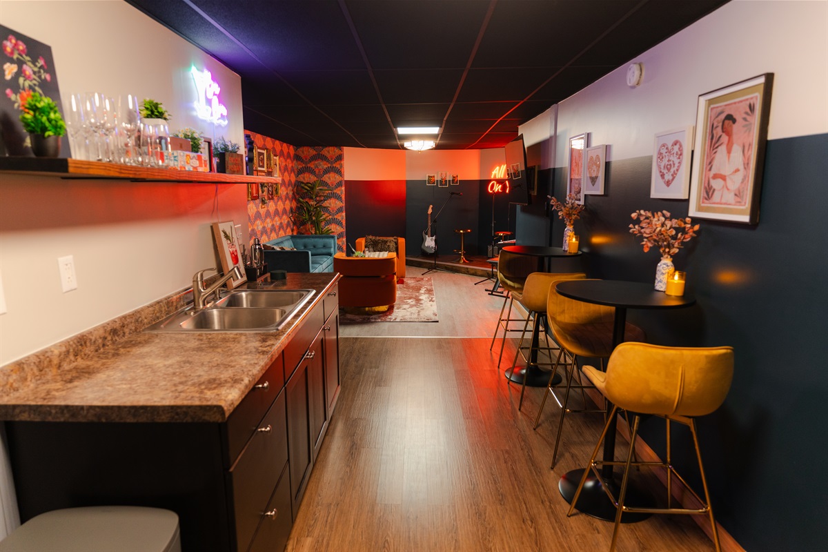 Extra hangout area with a kitchenette, bar seating, and room to relax with your group.