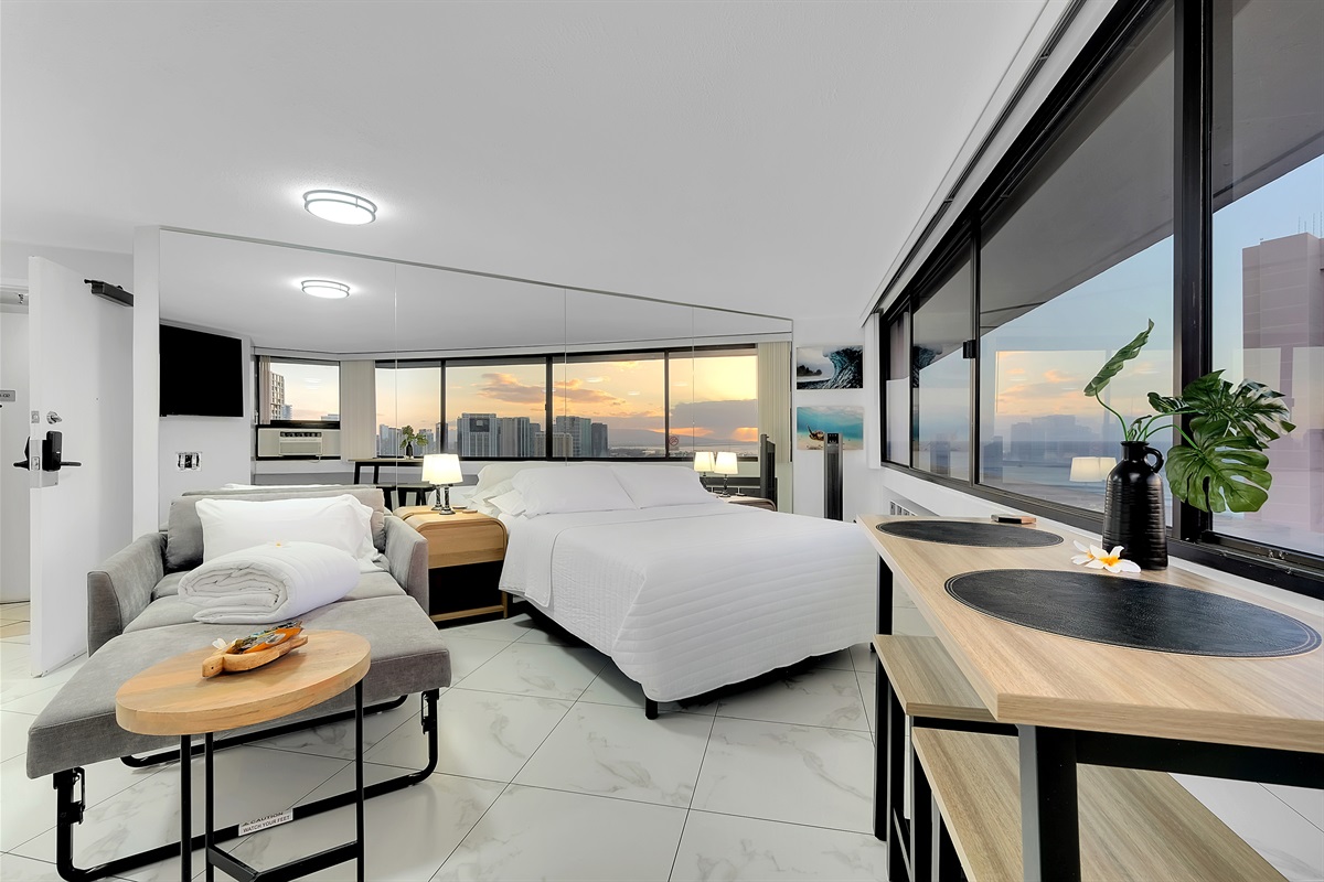 Modern elegance meets island serenity in this bright Waikīkī retreat. Enjoy ocean and city views from every angle, unwind on the plush sofa, and fall asleep to the glow of the Hawaiian sunset — the perfect home base for your Honolulu getaway.