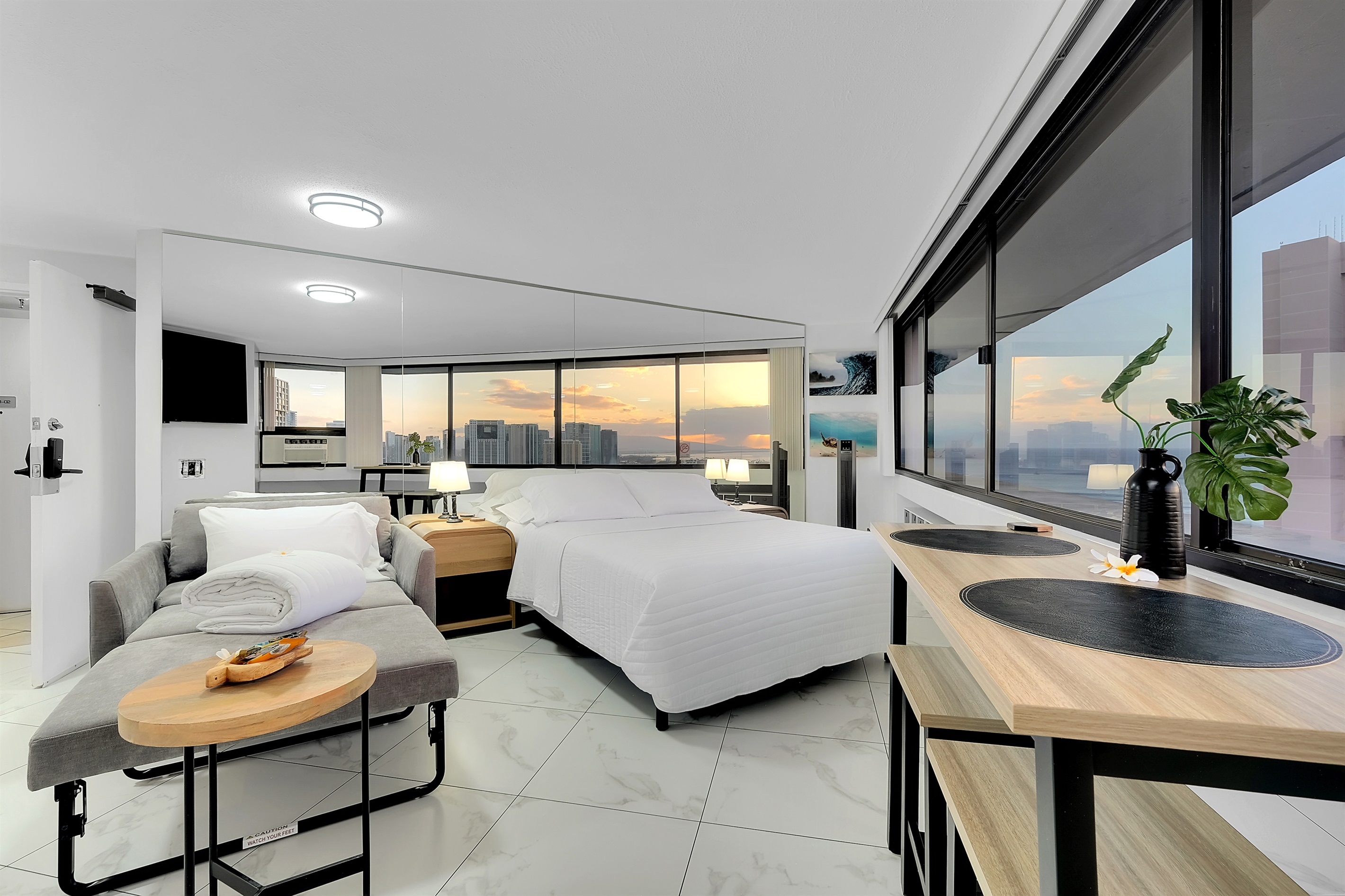 Modern elegance meets island serenity in this bright Waikīkī retreat. Enjoy ocean and city views from every angle, unwind on the plush sofa, and fall asleep to the glow of the Hawaiian sunset — the perfect home base for your Honolulu getaway.