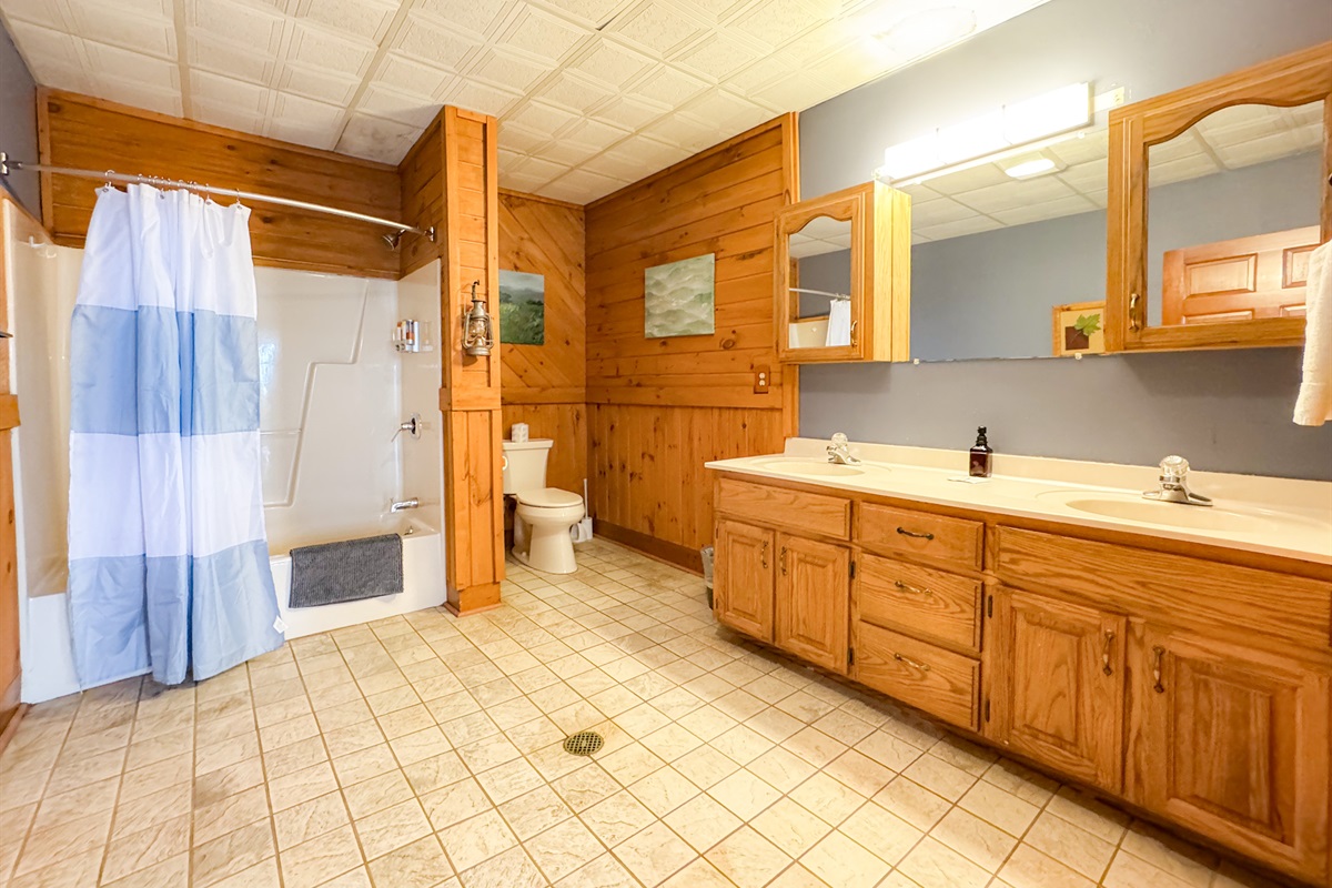 This bathroom is in the middle of the lower level and is just off the kitchen