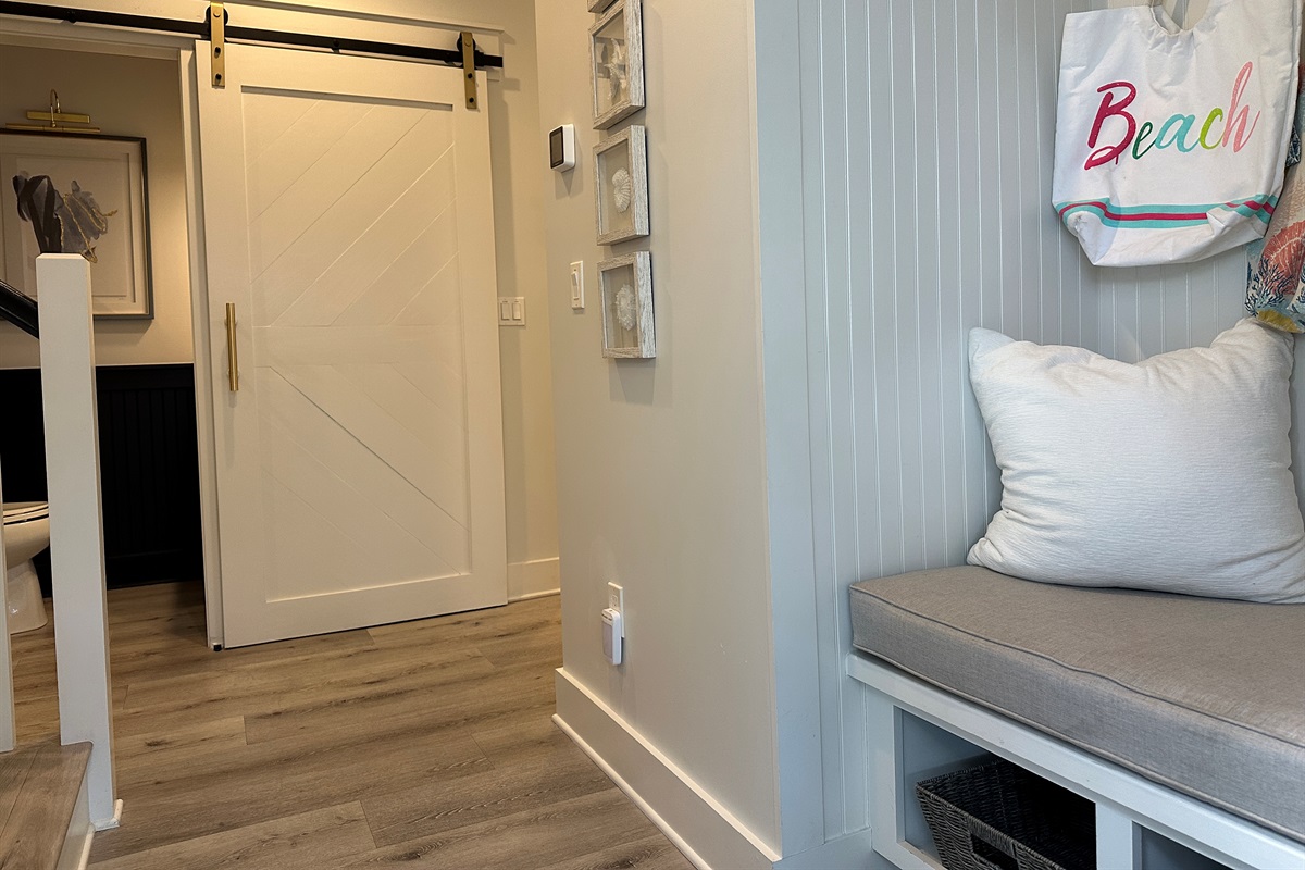  Convenient drop zone by the front entry with beach bags ready for your seaside adventures—pack up with ease and head out for a perfect day on the sand and surf! ☀️
