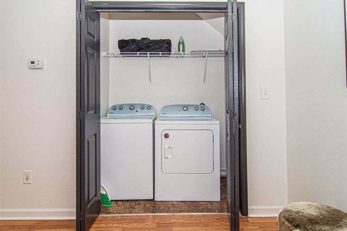 Keep your vacation wardrobe fresh with our in-unit laundry facilities, hidden away for your convenience.