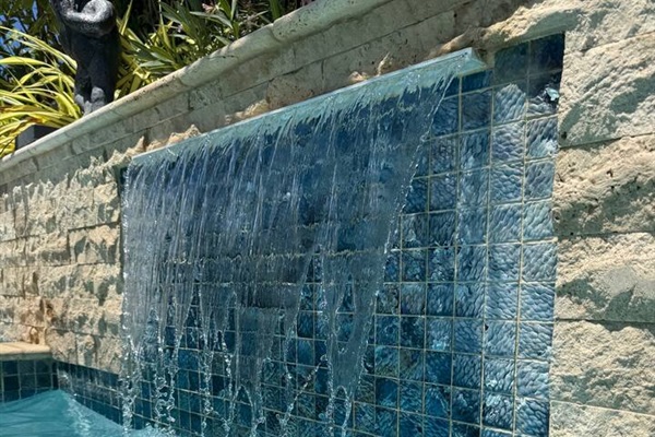 Waterfall feature in pool provides a nice water soundscape!