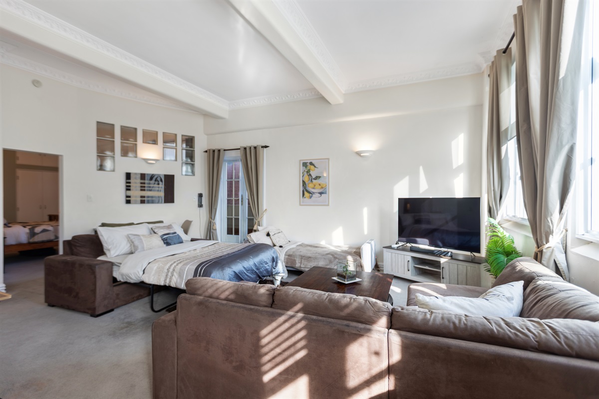 Lounge room with both sofabeds made up