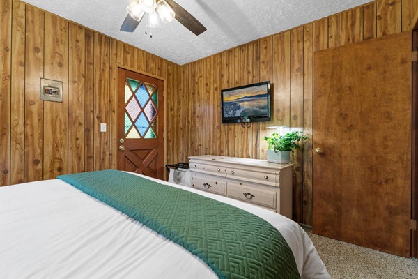 Our master bedroom is located upstairs and features a king size bed, balcony, and smart TV