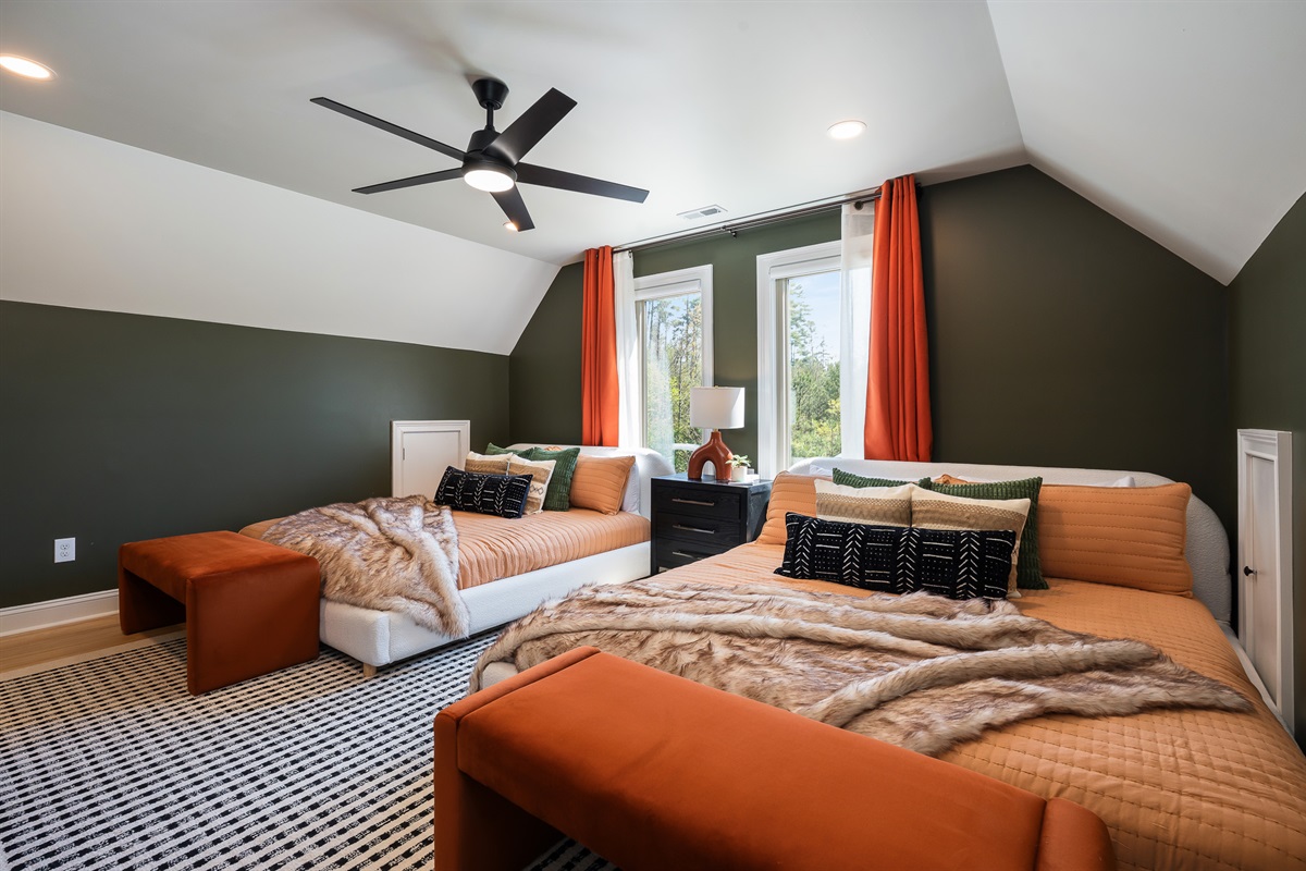 Spacious bedroom with multiple beds - ideal for groups who want to stay together comfortably