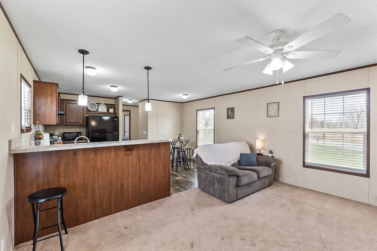 Spacious living area with breakfast bar seating and open layout for easy gatherings and family time.