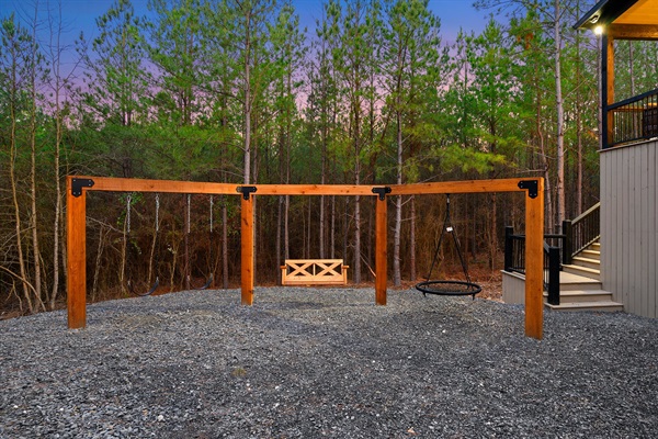 Enjoy the fresh forest air while kids swing and play just steps from the cabin.