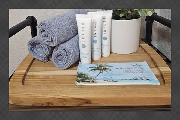 Travel size toiletries provided including makeup wipes.