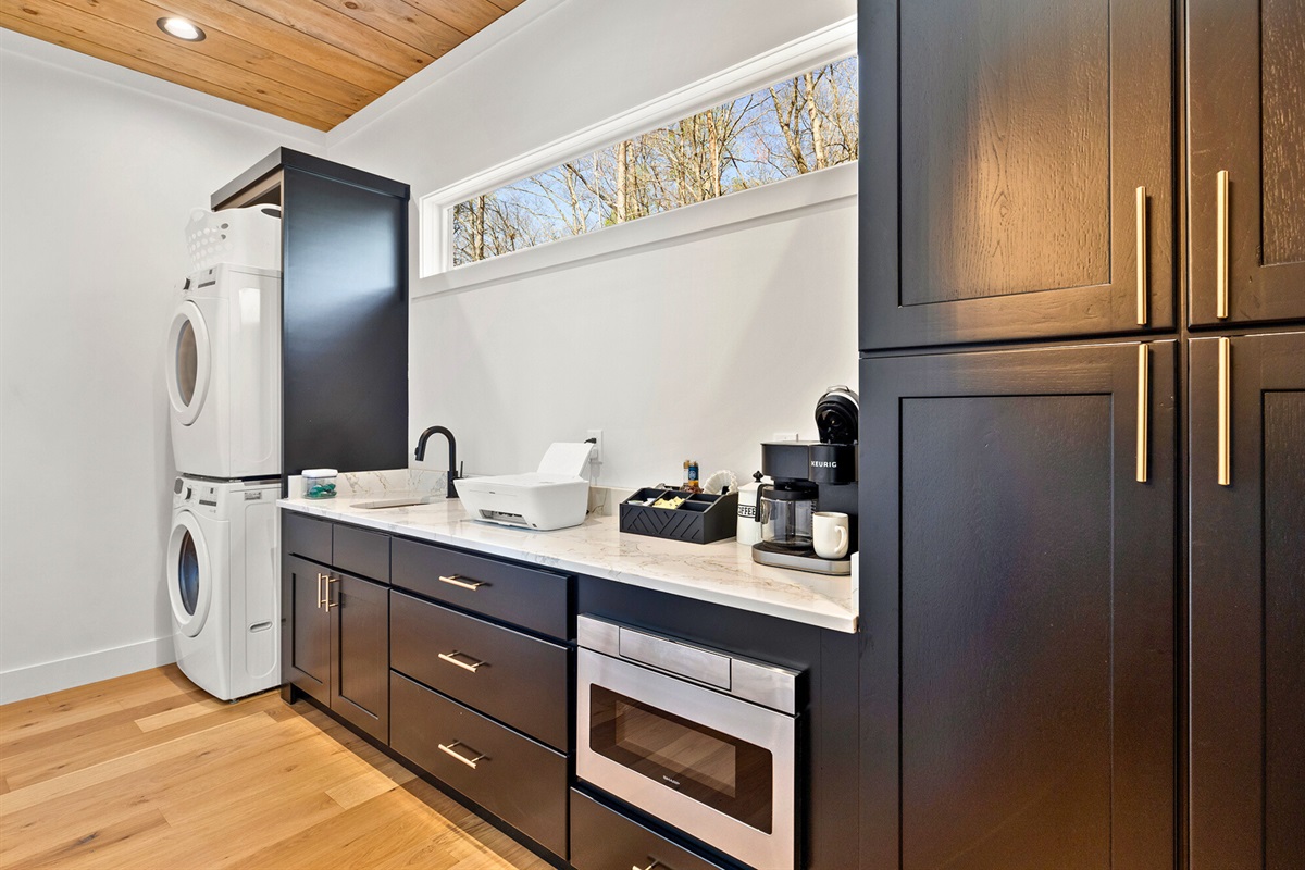 The hidden room near the kitchen is equipped with your morning and evening cup of gourmet coffee.