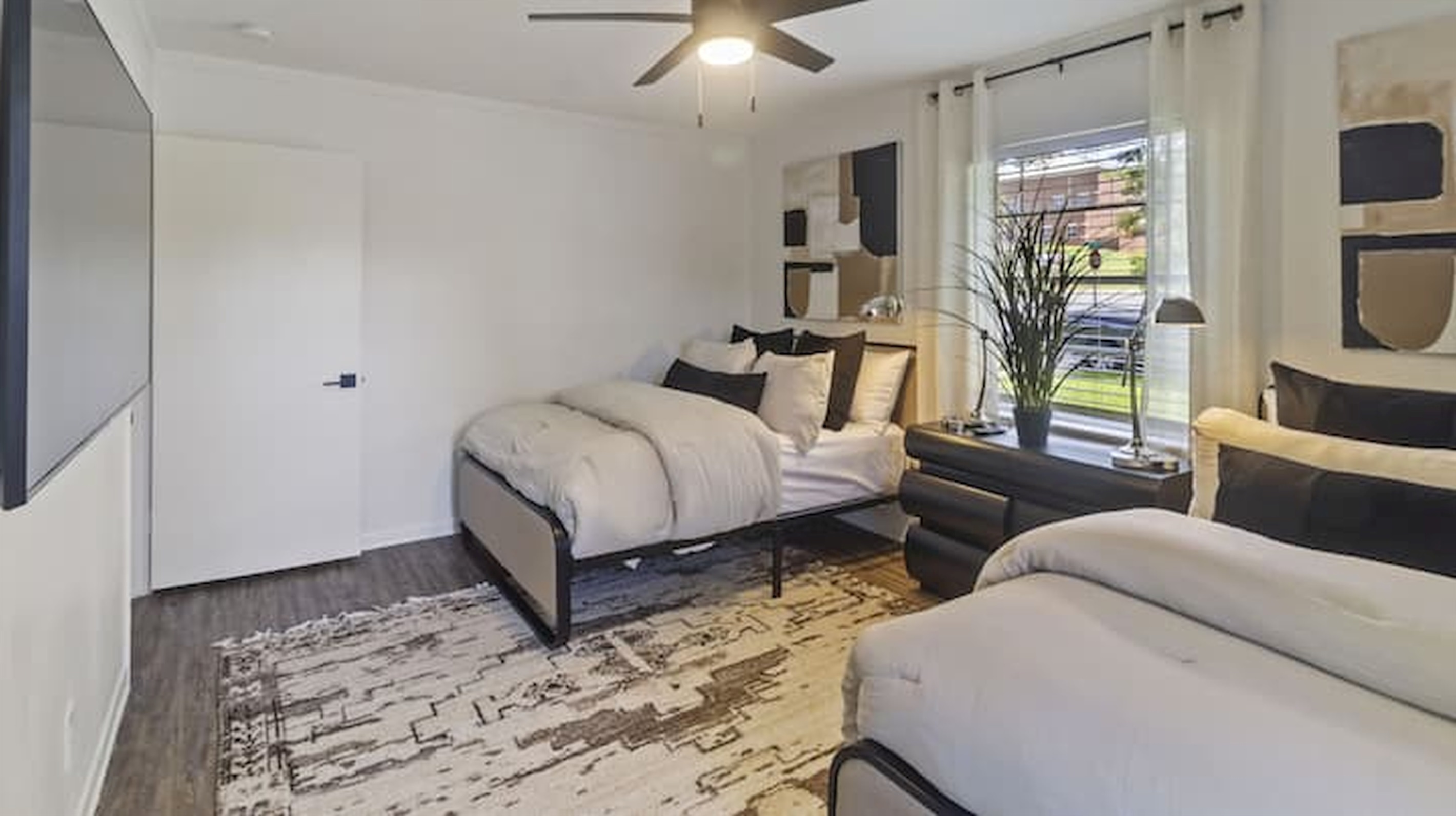 Spacious double queen bedroom with flexible sleeping arrangements for groups and families.