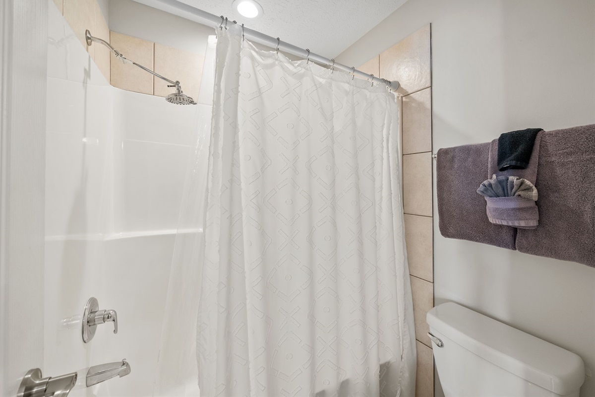 Tub/Shower combination in a separate room so some can be getting ready while another showers.