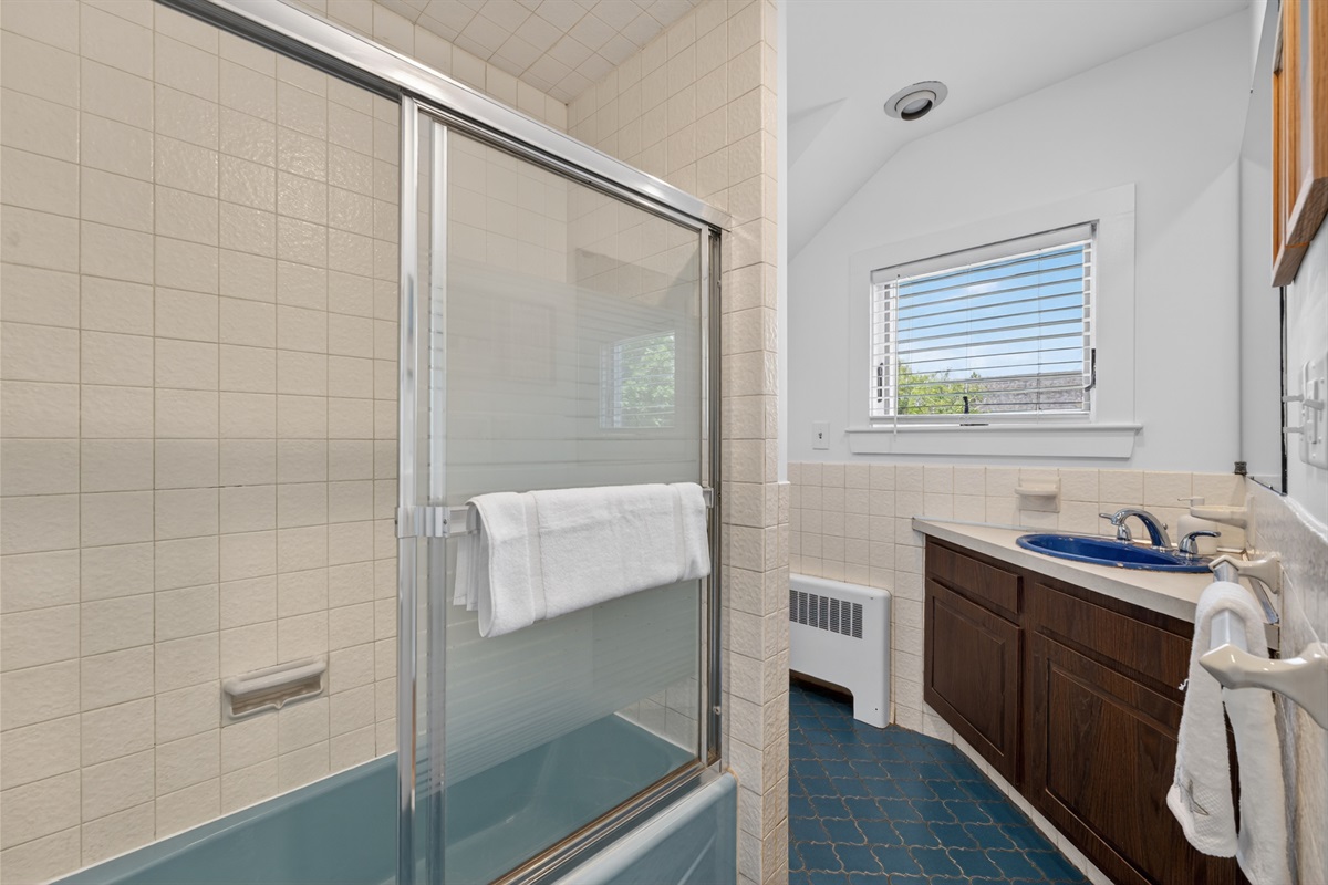 Full spacious bathroom designed for comfort and convenience with ample space and essential amenities.