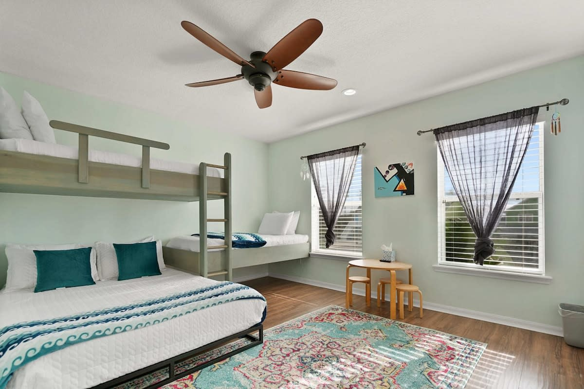 The bunk room: a full-size bed with two twins built in above and alongside, in a clever bunk-style arrangement. The children will fight over it, and then they will remember it for years and years afterwards.