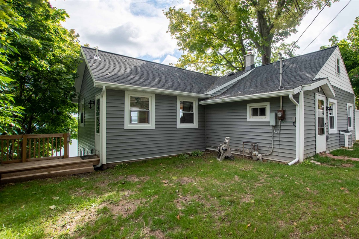 Spacious exterior with room to unwind, grill, and enjoy the fresh lake air.