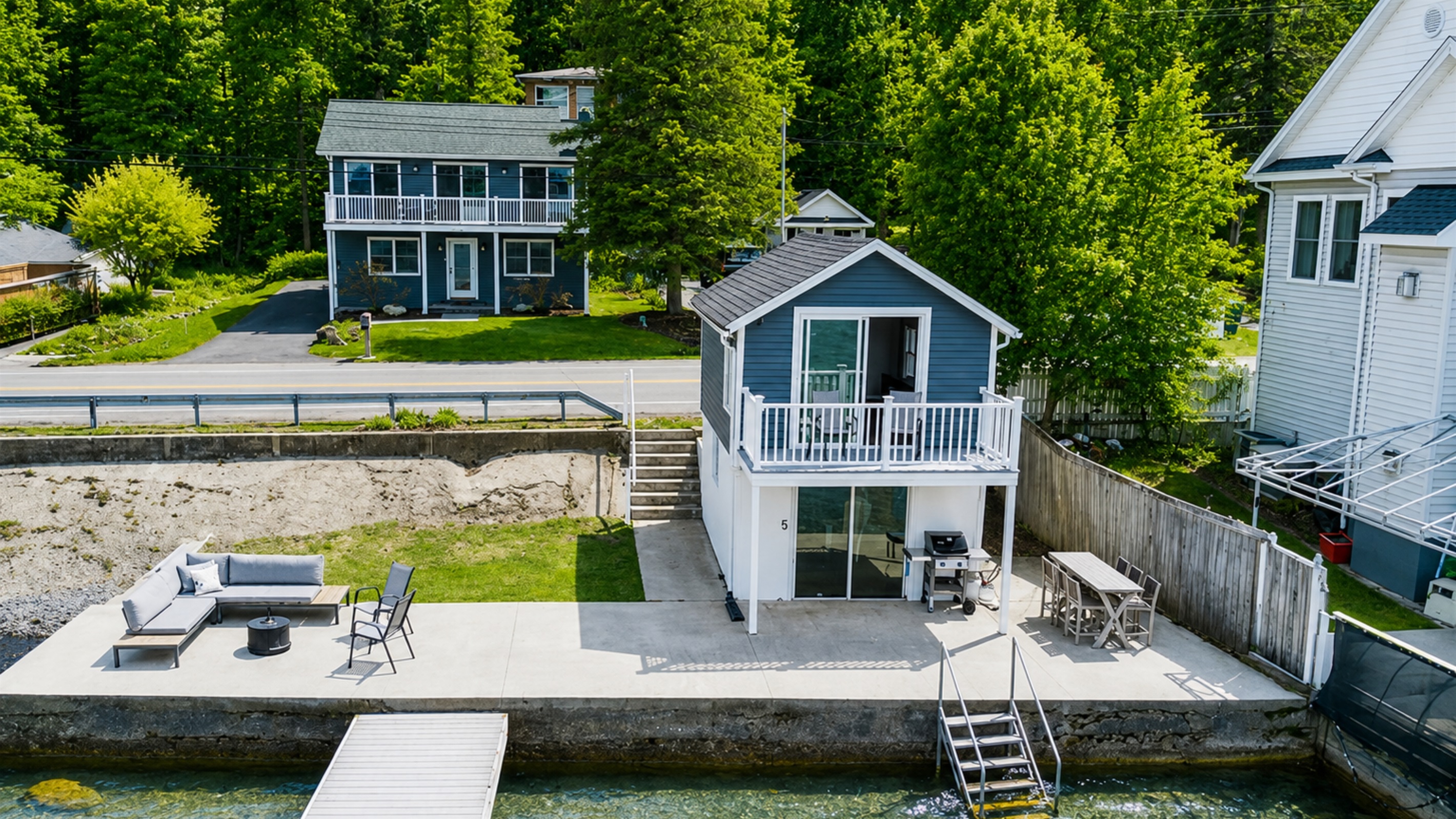 Charming two-story vacation rental with a private driveway, fresh landscaping, and modern curb appeal—perfectly situated in the heart of the Finger Lakes! 🏡🌲🚗