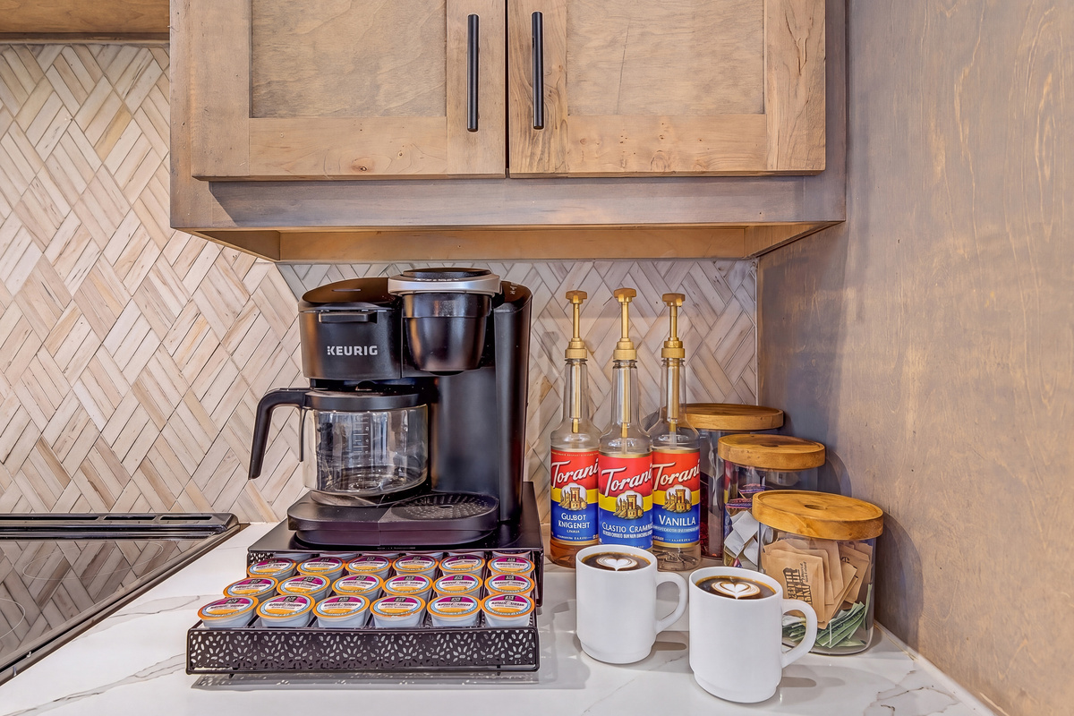 Morning coffee is covered because treehouse mornings are better with caffeine! Enjoy a Keurig Duo, K-Cups, coffee grounds, flavoring syrups, creamers, sugar packets, stevia packets, an electric kettle, and a French press!