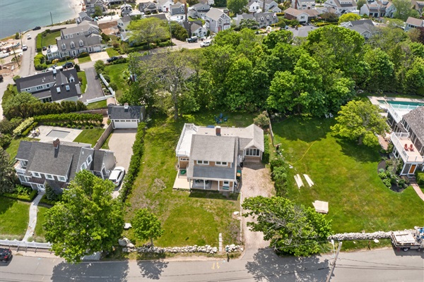 An aerial view of the house showing the overall property layout and surrounding outdoor spaces.