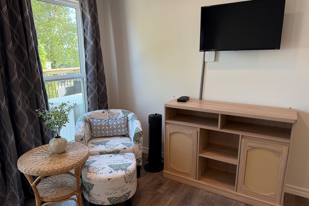 Relax in Master Bedroom and view expansive upper deck while drinking coffee