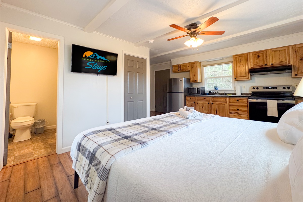 The separate apartment suite features a comfy King size bed with cooling memory foam gel and high thread count bedding. There is a smart TV, a small ensuite bathroom, refrigerator, coffee maker, and some kitchen items. Mostly for drinks and such.