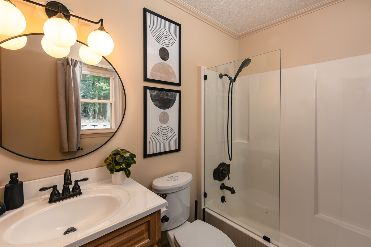 {Bathroom 2} This full bathroom features a tub and shower combination, generous vanity space, and clean modern finishes.