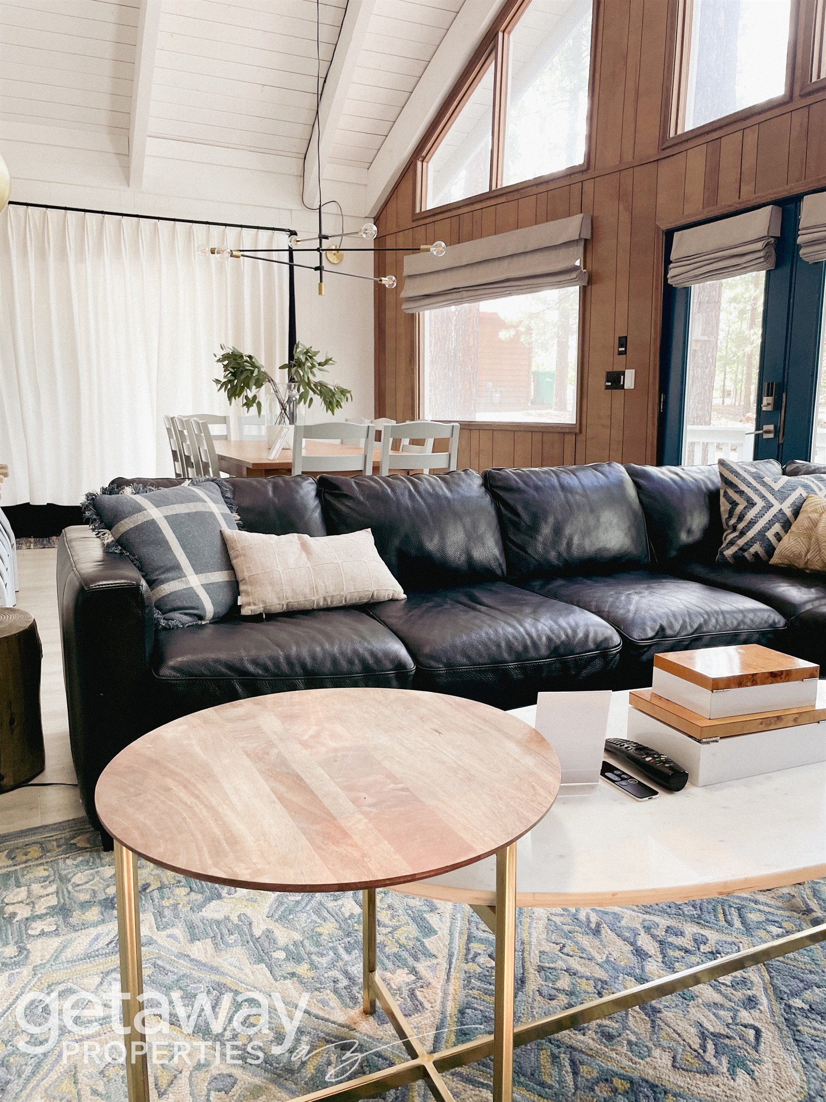 Warm, inviting living room with fireplace and smart TV — ideal after a day in the White Mountains