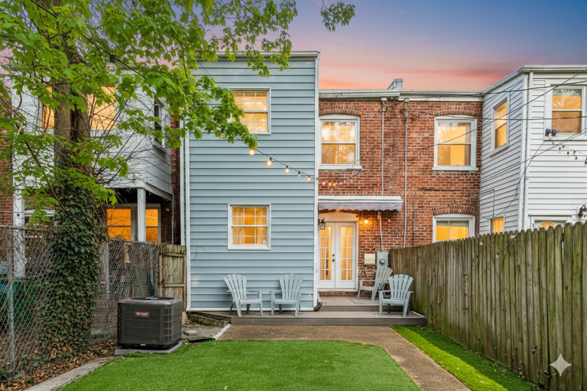 Outdoor Retreat: Unwind on the patio amidst twinkling lights and lush greenery!