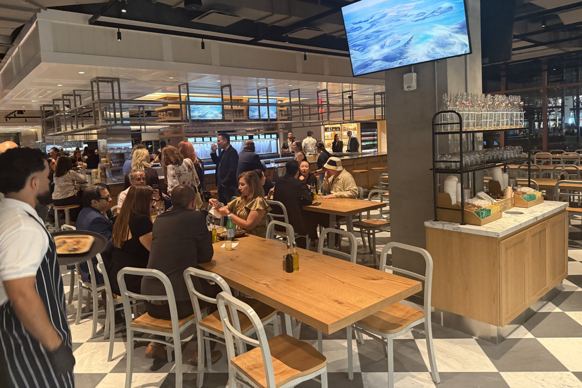 Casa Tua market hall - communal tables for handmade pasta and woodfire pizza.