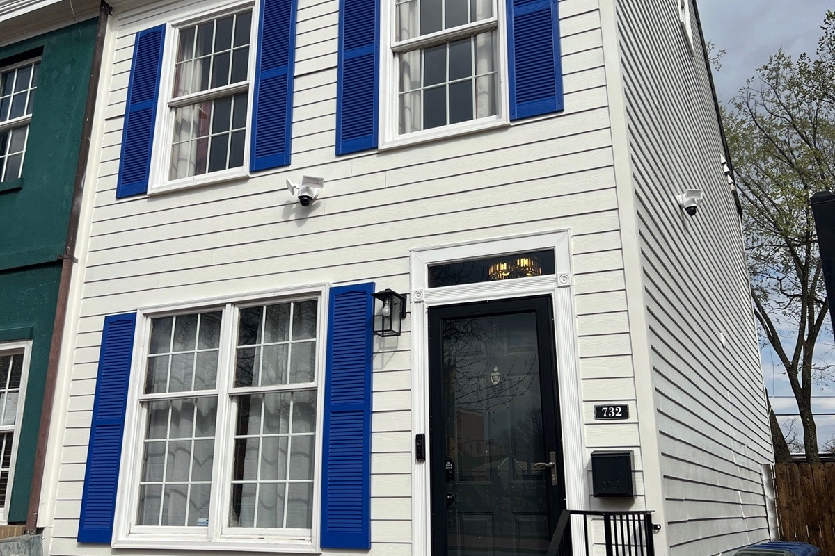Charming Capitol Hill home with bright blue shutters and a welcoming entrance