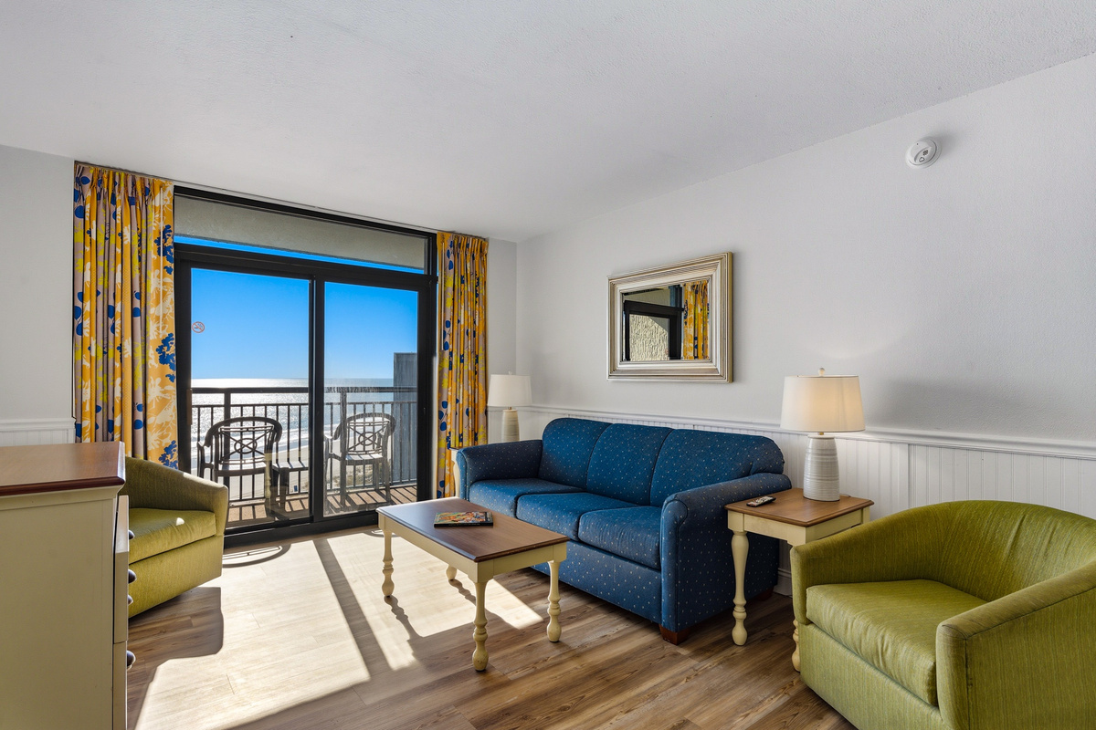 Living room with sofa and balcony access