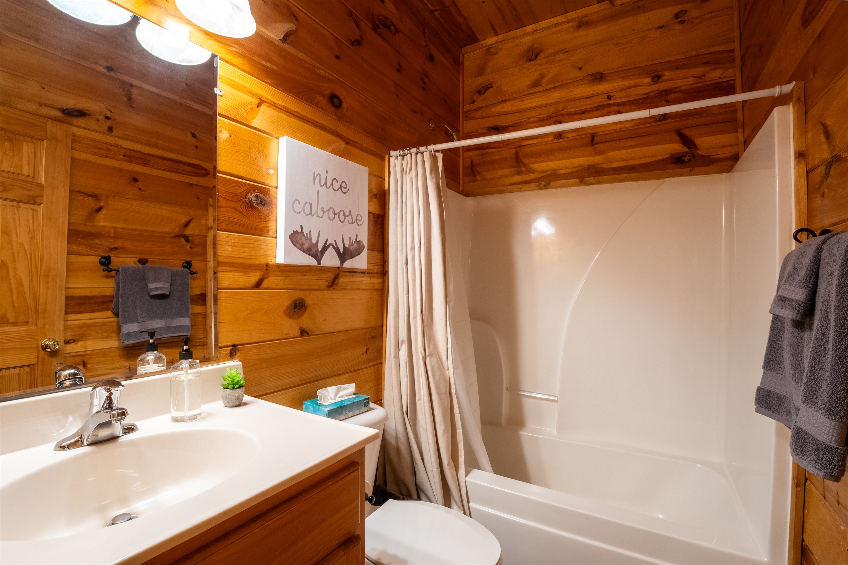 The ensuite bathroom has a tub-shower combo.
