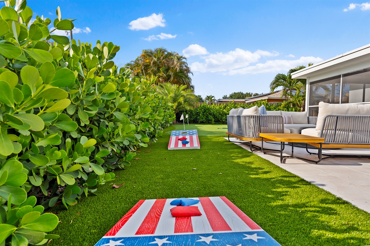 Backyard games and sunny afternoons await with a spacious lawn, cozy lounge seating, and vacation-ready vibes.