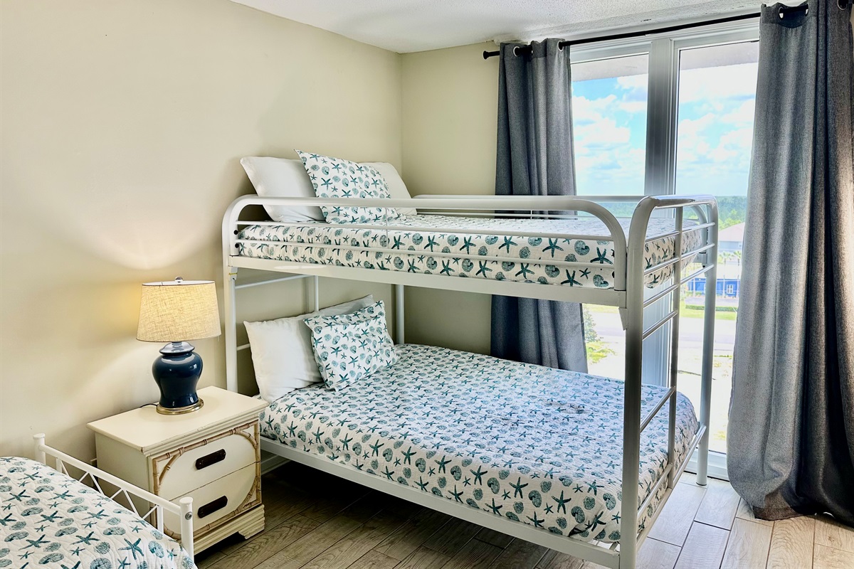 Full sized bunk beds and two twin beds in this kid friendly room!