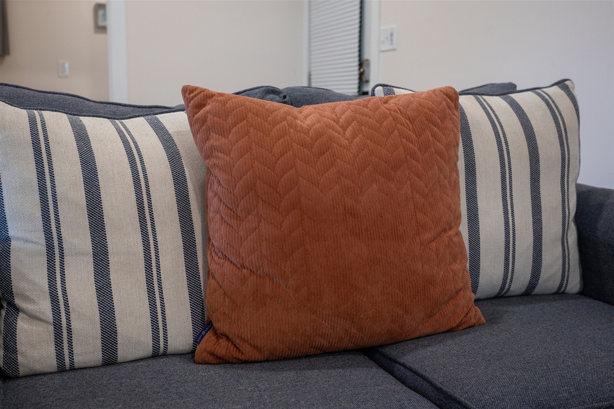 Sink into the plush sofa with soft pillows—perfect for morning coffee or evening wine.