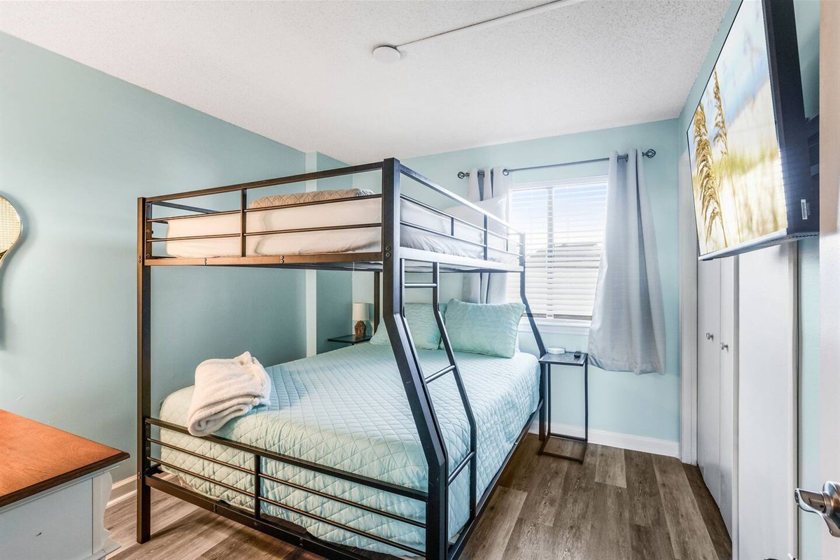 Full XL over Queen. Great for adults and kids too! Smart TV, charging station, closet and dresser. (No kids under 6 allowed on top bunk for safety)