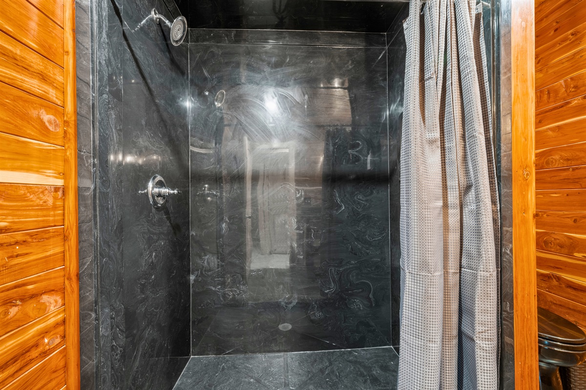 The walk-in shower offers plenty of room to refresh and relax after time spent outdoors.