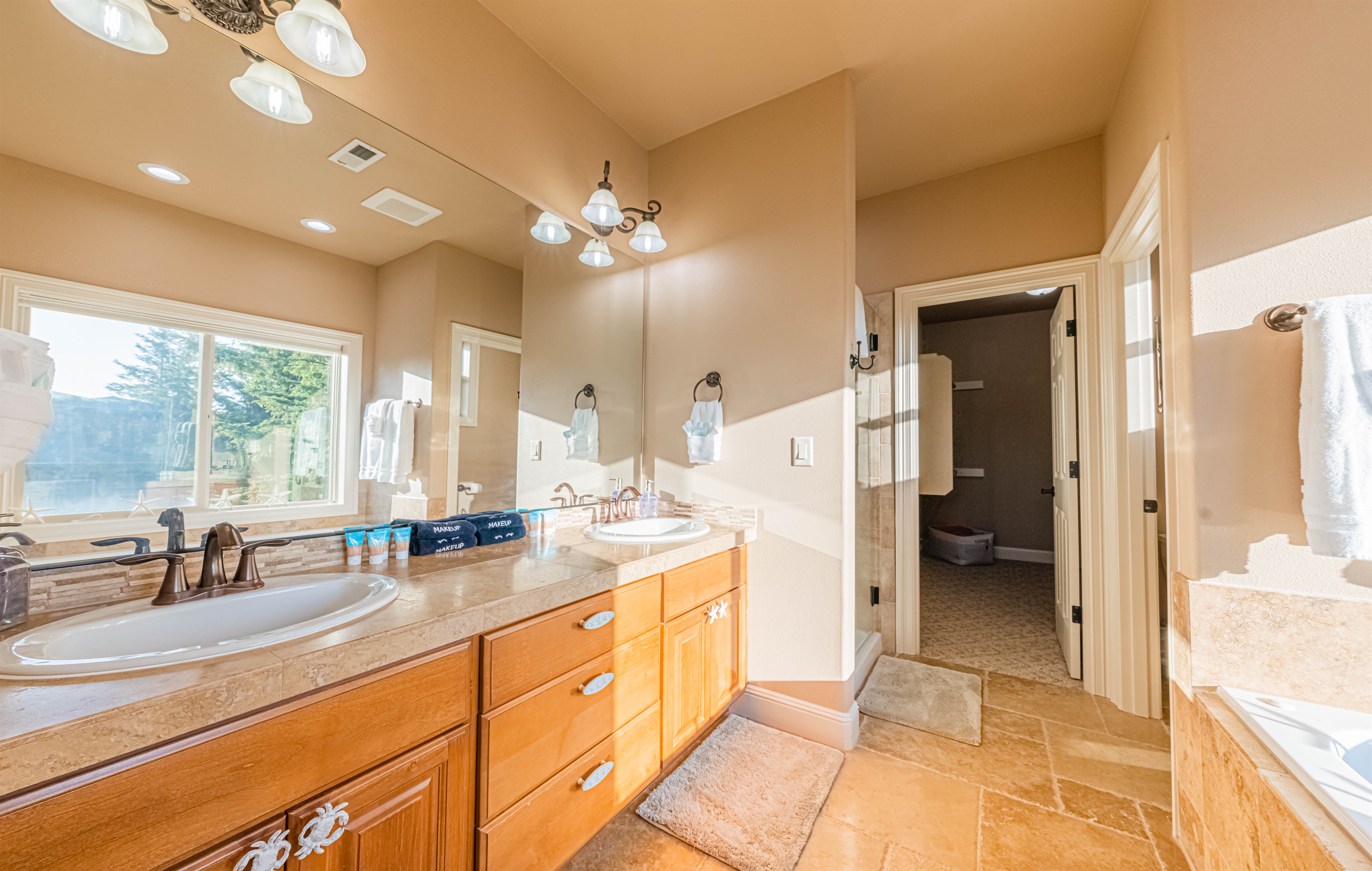 Sunny & bright 5 pc ensuite with jetted tub and walk-in shower.
