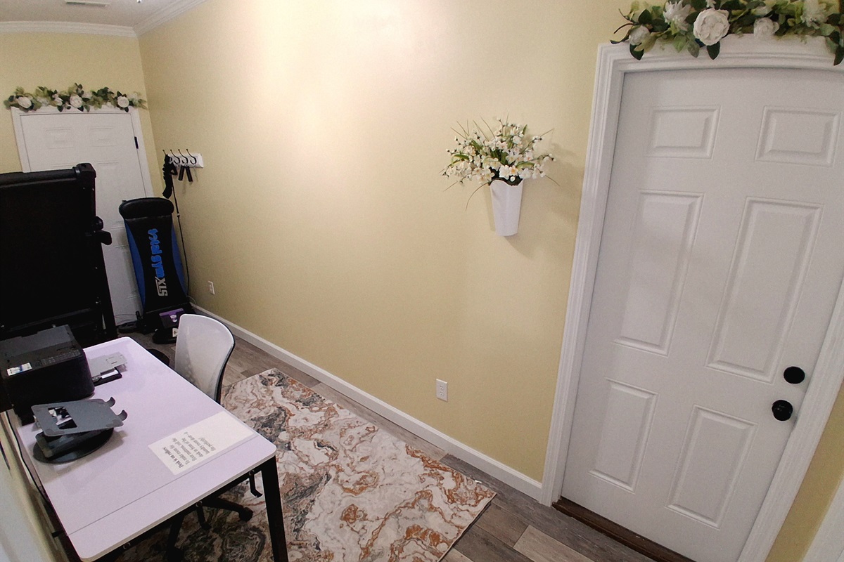 This space can easily convert into an additional sleeping area — just roll the desk aside and set up the floor mattress, complete with cozy bedding.