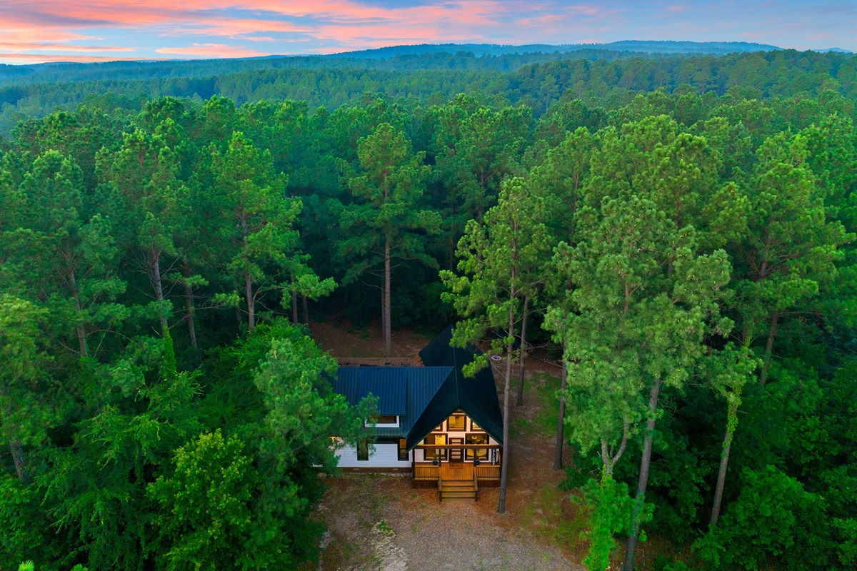 Exterior: Unwind in nature’s embrace with stunning forest views and tranquil sunsets!