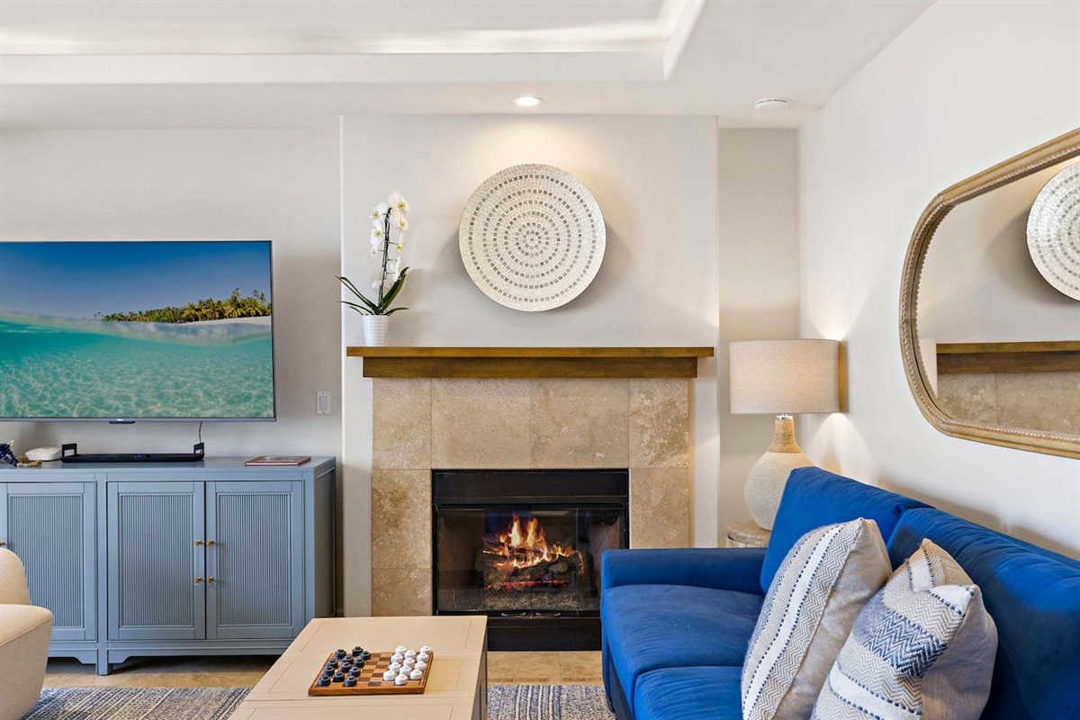 Enjoy the cozy fireplace while you watch your favorite shows on a 65" smart TV (to the left of the fireplace).  We offer Amazon Prime, Sling TV, Peacock, Hulu, Disney, Max and Paramount plus as well as over 300 movies in our amazon library.