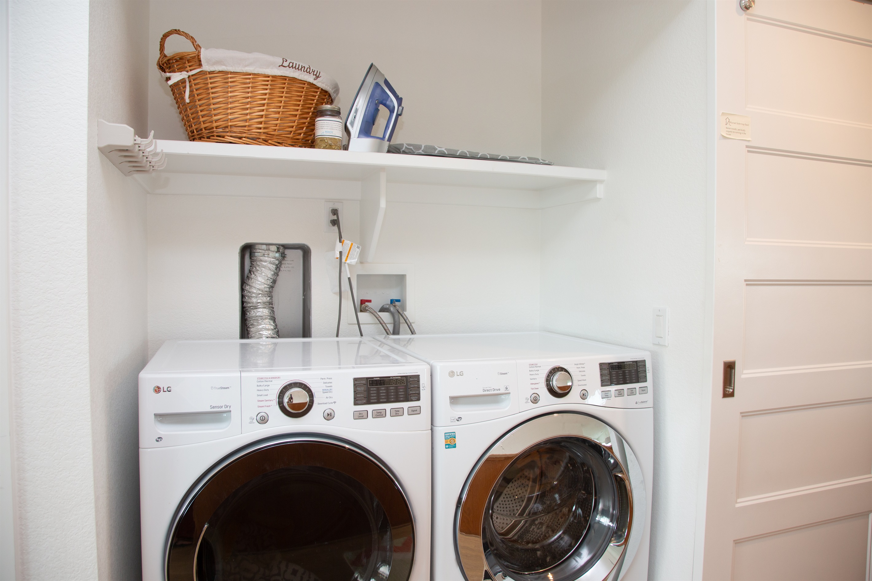 Washer and dryer behind the barn doors