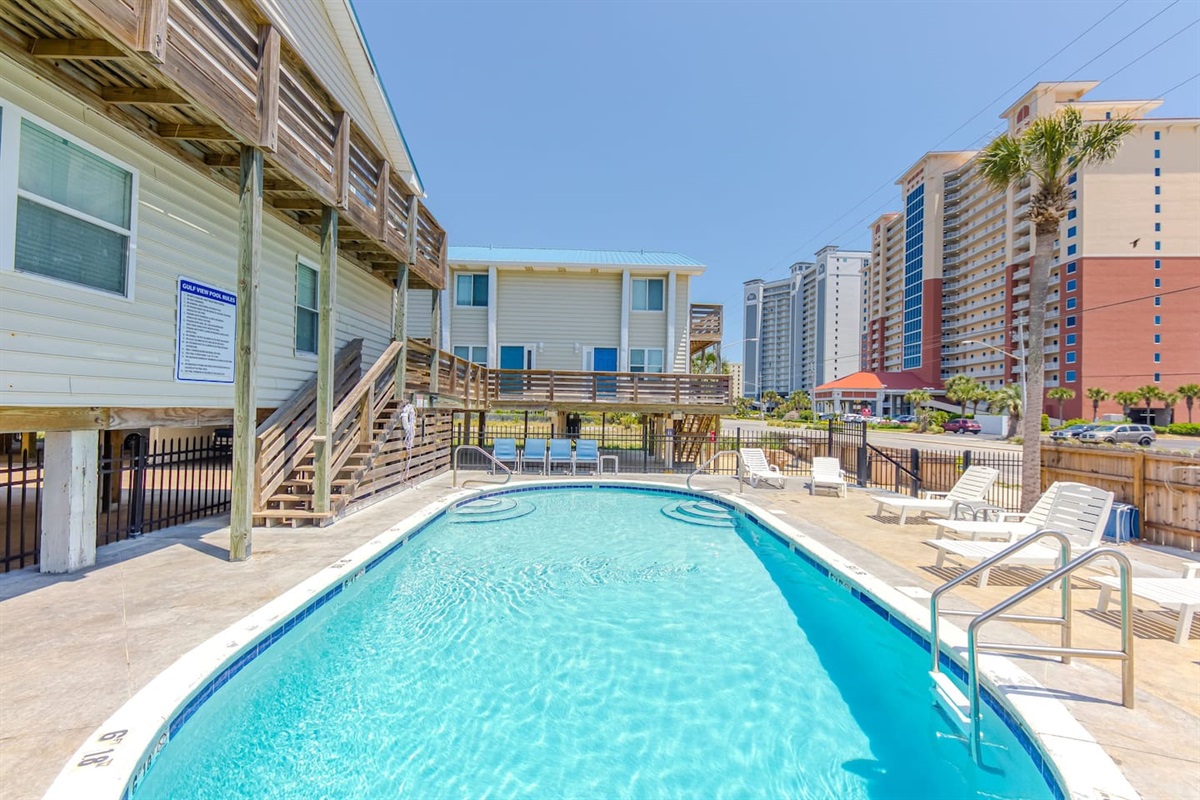 Poolside Retreat: Dive into relaxation by the sparkling pool!
