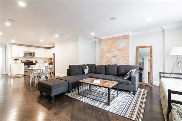 Perfect for families, couples, and friend groups. Main living area with full kitchen and modern appliances. Living area has a sectional sofa, full sized daybed, and 55 inch flatscreen TV.