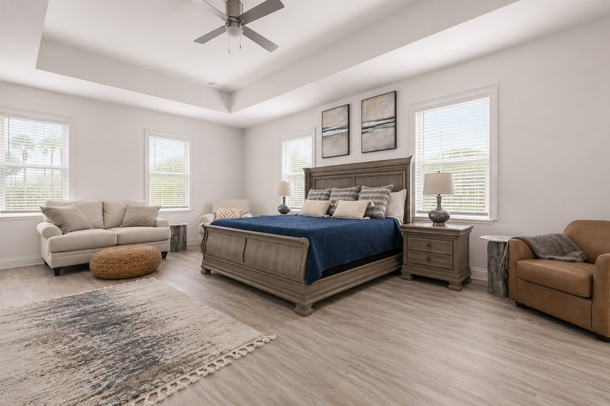 Room to truly unwind: this spacious primary suite pairs a dreamy king with a cozy sitting nook made for quiet conversations. Curl up with your love at day's end, trade stories from the beach, and let the calm carry you into deep, restful sleep.
