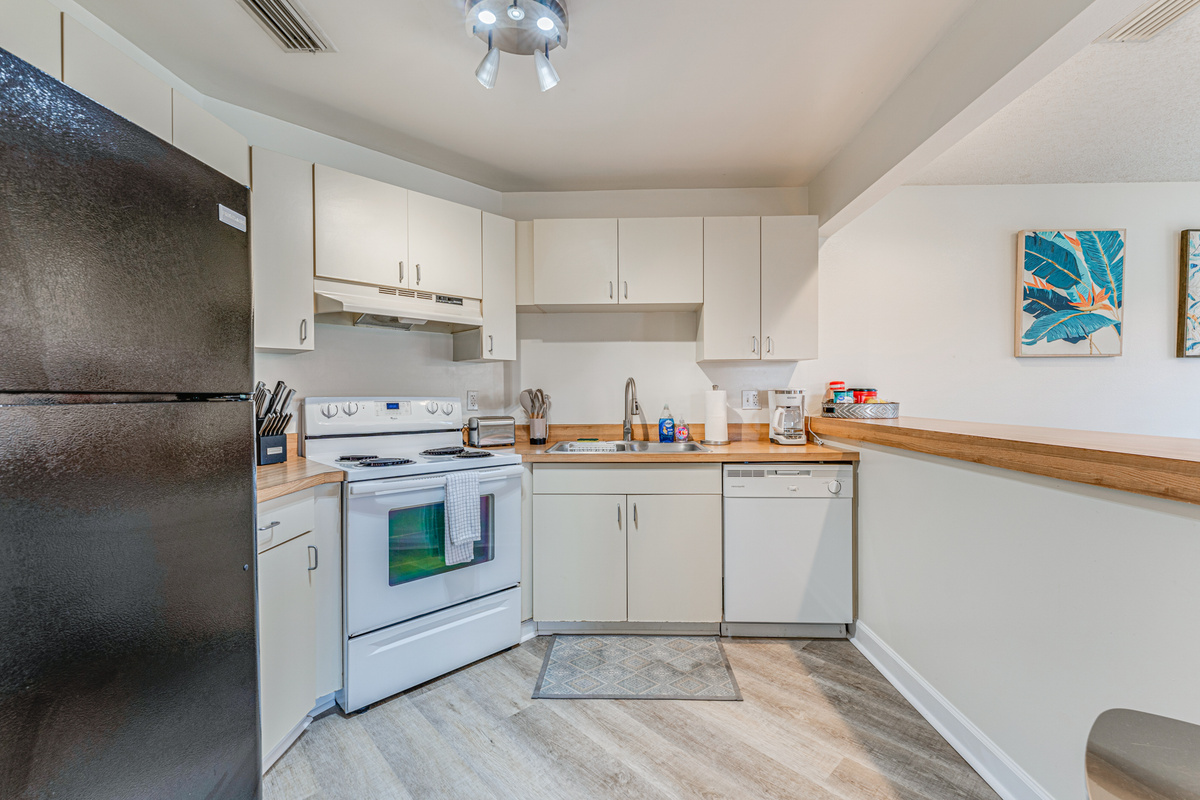 Fully equipped with modern appliances and essential cookware, the kitchen makes preparing meals easy&mdash;whether you're brewing your morning coffee or cooking a fresh seafood dinner.
