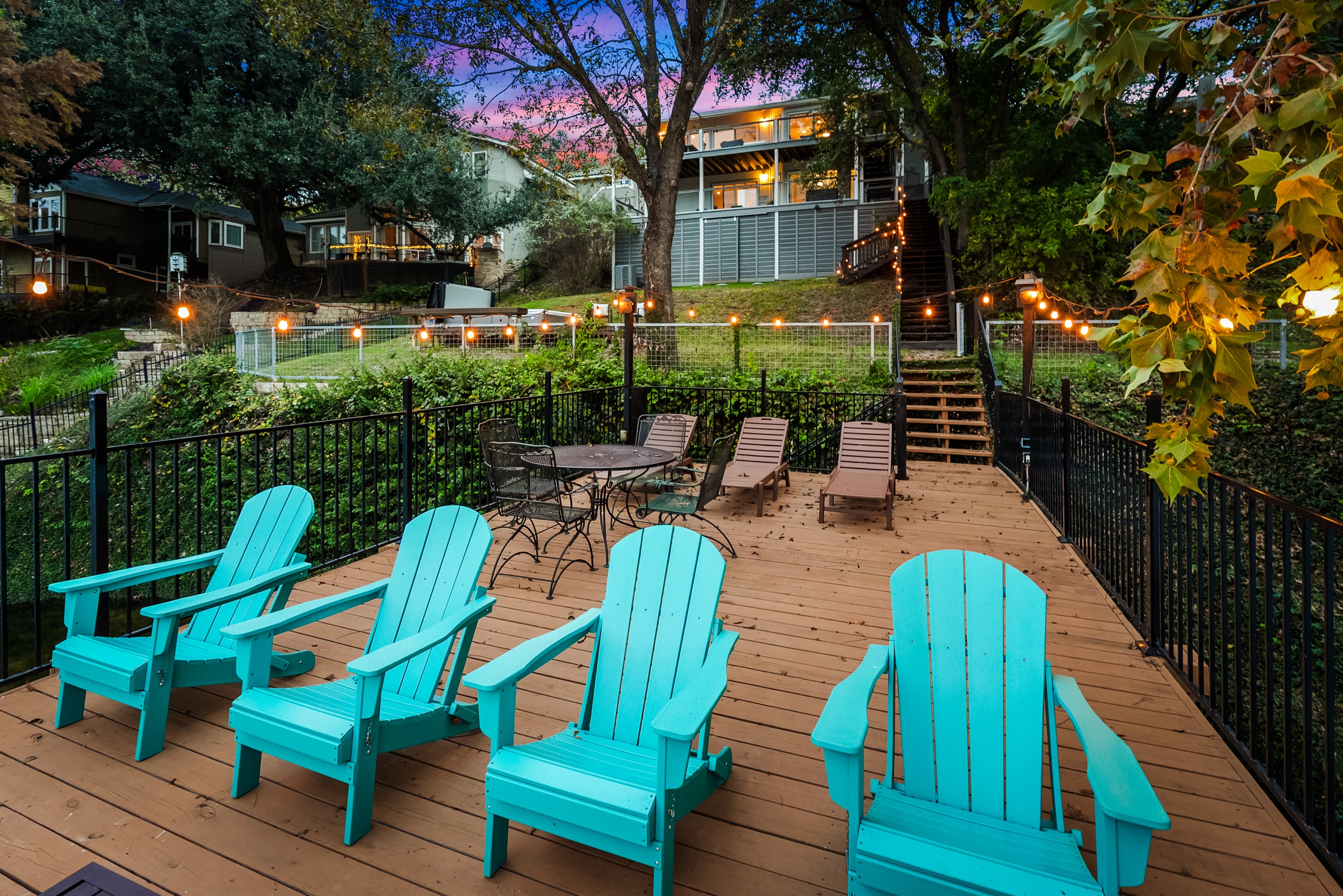 Beautiful deck with seating for large groups and string lights