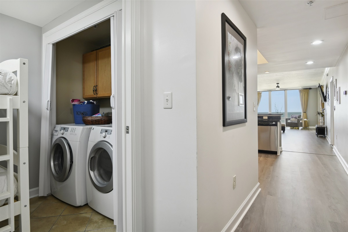 Laundry behind sliding doors in bedroom 3.Looking down main hall.